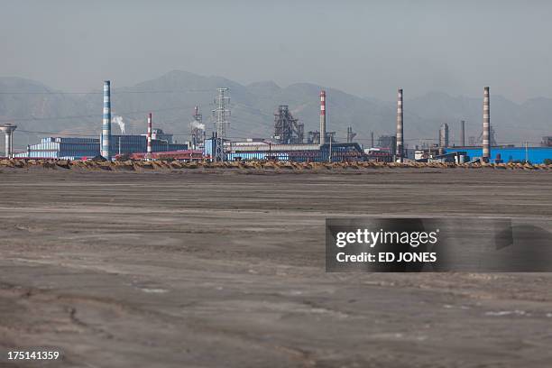 Photo taken on August 19, 2012 shows a general view of a 'toxic lake' surrounded by rare earth refineries near the inner Mongolian city of Baotou. On...