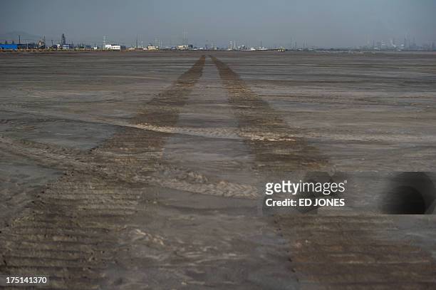 Photo taken on August 19, 2012 shows a general view of a 'toxic lake' surrounded by rare earth refineries near the inner Mongolian city of Baotou. On...
