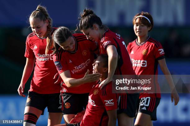 Nikita Parris of Manchester United celebrates scoring her second goal with team mates during the Barclays Women´s Super League match between Everton...