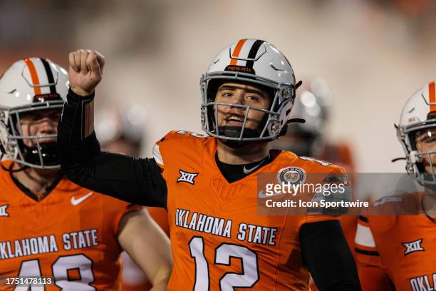 Oklahoma State Cowboys quarterback Gunnar Gundy leads the team onto the field for the game against the Cincinnati Bearcats on October 28th, 2023 at...