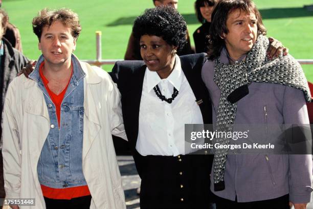 Scottish singer Jim Kerr of Simple Minds, Winnie Madikizela-Mandela and English singer Peter Gabriel attend backstage a concert held at Wembley...