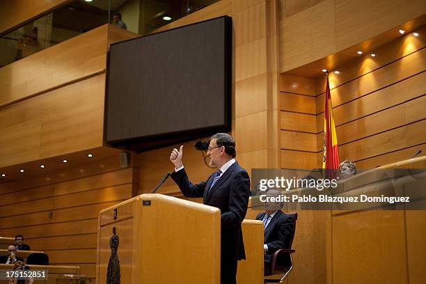 Spanish Prime Minister Mariano Rajoy speaks during a parliament session over allegations on corruption scandals on August 1, 2013 in Madrid, Spain....