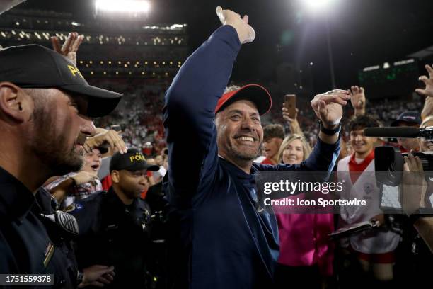 Arizona Wildcats head coach Jedd Fisch celebrates with the fans after the Arizona Wildcats defeated the Oregon State Beavers 27 - 24 on October 28,...
