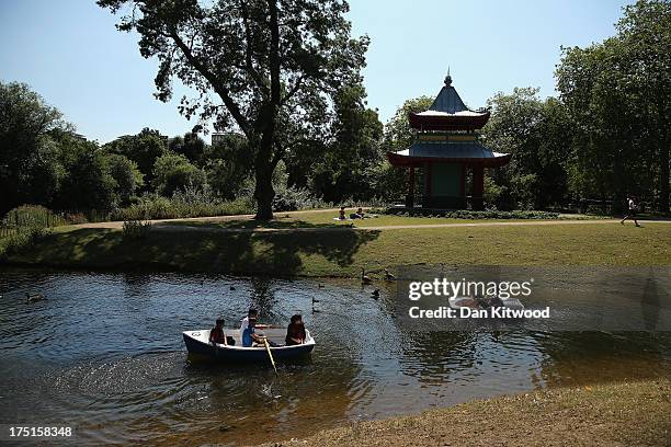 Boaters enjoy the lake in Victoria Park on August 1, 2013 in London, England. A heatwave has returned to much of the country with temperatures...