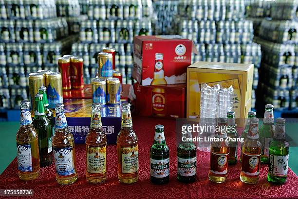 Beer is displayed at the Jinzhu Manjiang beer factory on August 1, 2013 in Fujin, Heilongjiang Province, China. Recent significant sustained high...