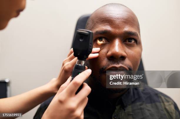 eye exam, tool and black man with doctor, optometrist and vision microscope for healthcare. ophthalmology, test and woman check patient for optical glaucoma with medical equipment in clinic or office - black eye 個照片及圖片檔