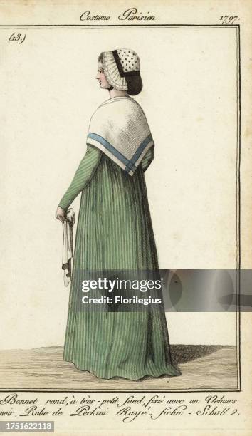 Woman in striped dress with kerchief shawl, 1797. She wears a round bonnet with a small crown, fixed with black velvet. Dress in striped silk or...