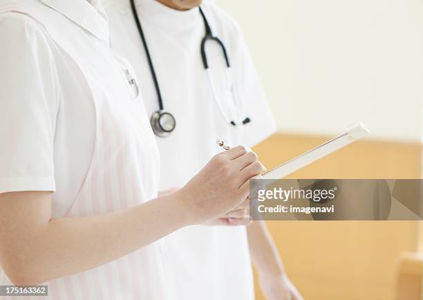 man and woman nurse talking - hand karte stock pictures, royalty-free photos & images