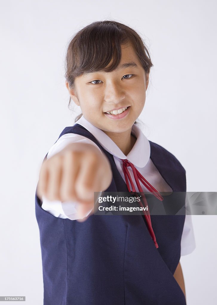 Junior high girl thrusting fist