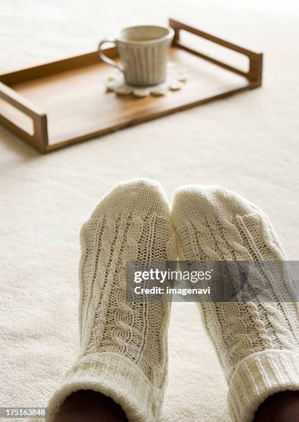 hot drink on a tray and feet wearing socks - japanese women feet stock pictures, royalty-free photos & images