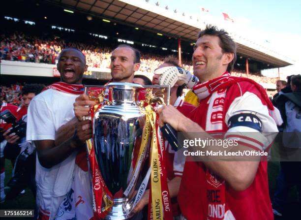 May 1998 Premiership Football - Arsenal v Everton - Patrick Vieira , Steve Bould and Arsenal captain Tony Adams with the Premiership trophy.