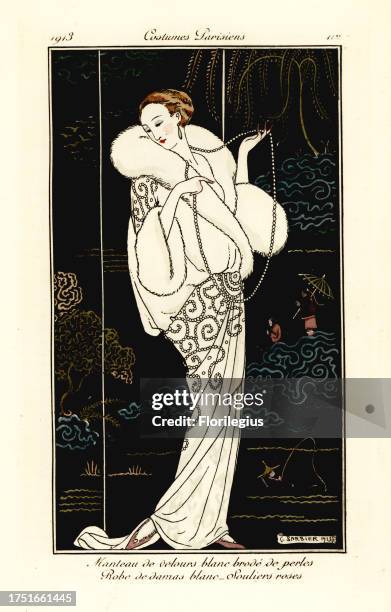 Woman in white velvet cape embroidered with pearls, white damask dress and pink slippers in front of Chinese lacquer screen. Manteau de velours blanc...