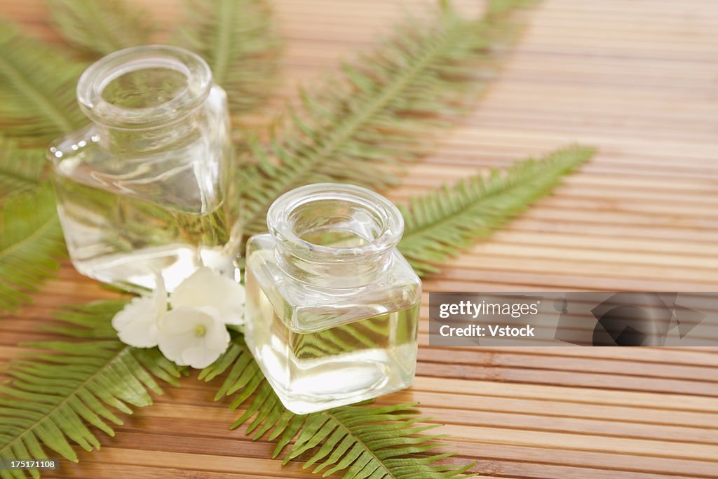 Two jars with massage oil in beauty spa, Studio shot