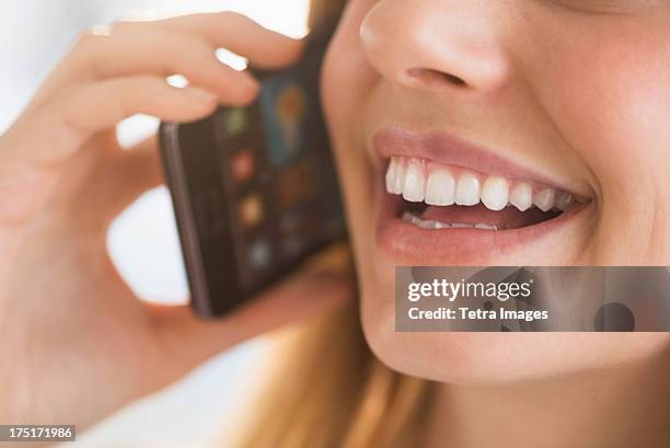 close-up of woman talking on phone - mouth talking stock pictures, royalty-free photos & images