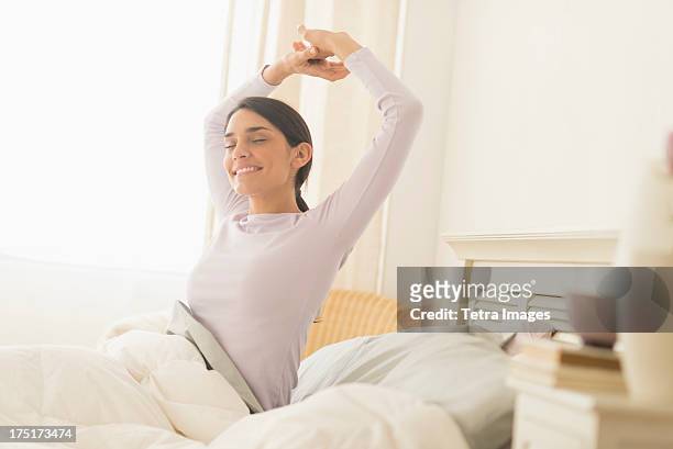 usa, new jersey, jersey city, woman waking up - waking up stock pictures, royalty-free photos & images