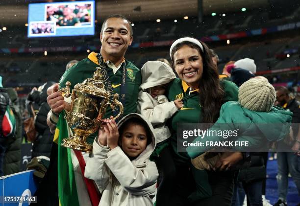 South Africa's left wing Cheslin Kolbe poses with his family after winning the France 2023 Rugby World Cup Final match between New Zealand and South...