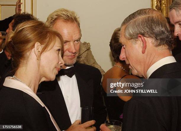 The Prince of Wales talks to pop star Sting and his wife Trudi Styler at a reception at Clarence House, his official London residence, where...