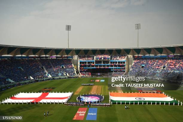 The national flags of England and India are displayed before the start of the 2023 ICC Men's Cricket World Cup one-day international match between...