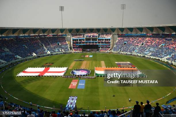 The national flags of England and India are displayed before the start of the 2023 ICC Men's Cricket World Cup one-day international match between...