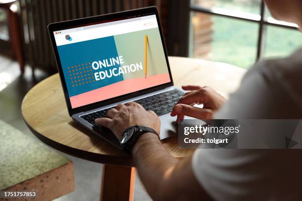 laptop with e-learning screen on a desk - laptop home stock pictures, royalty-free photos & images