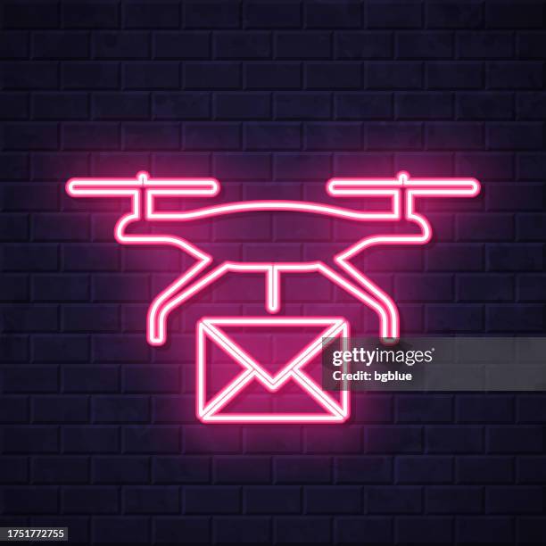 delivery drone with mail. glowing neon icon on brick wall background - pilot program stock illustrations