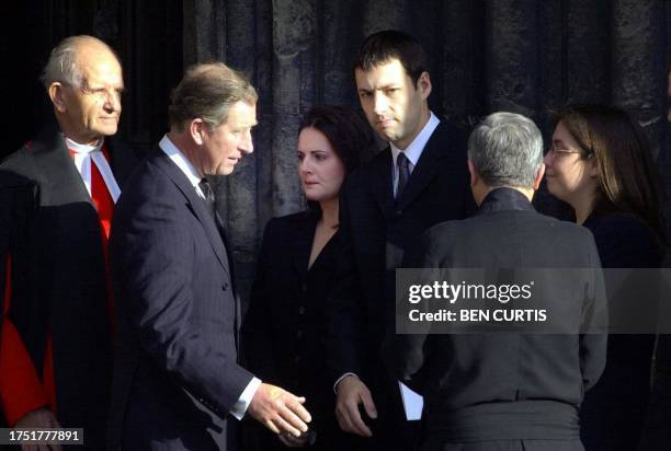 Prince Charles speaks to Donald Dewar's family after the late Scottish first premier's funeral service at Glasgow Cathedral 18 October 2000. Dewar's...