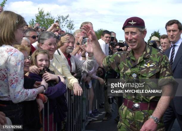 Prince Charles salutes the crowd, 04 June 2000, during the inauguration of the Pegasus Bridge memorial in Ranville, Normandy, where the first forces...