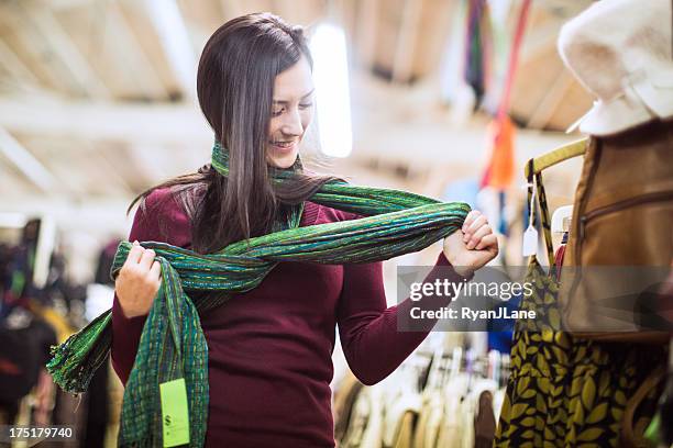 thrift store shopping young woman - sjaal stockfoto's en -beelden