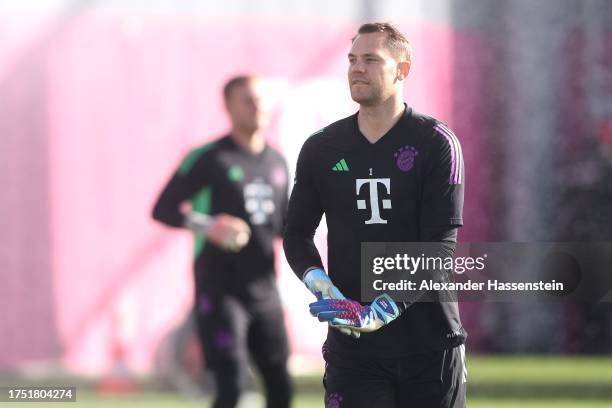 Manuel Neuer of FC Bayern München looks on during a training session at FC Bayern München training ground Saebener Strasse on October 23, 2023 in...