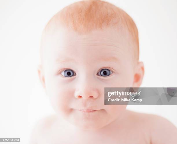 studio shot portrait of surprised baby boy (18-23 months) - raised eyebrows stock-fotos und bilder