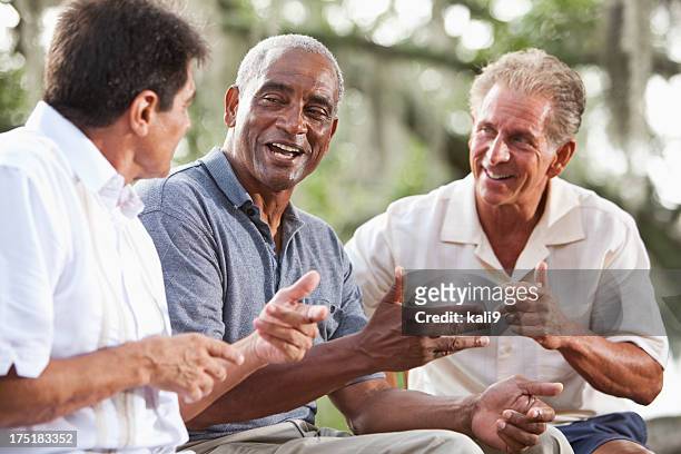 multi-ethnic men talking - 3 old people stockfoto's en -beelden