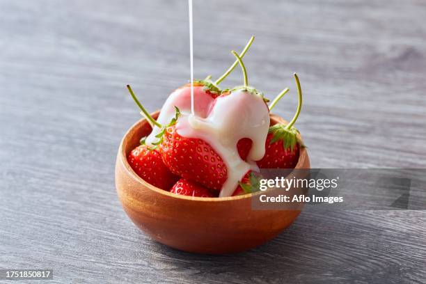 strawberries - condensed milk foto e immagini stock