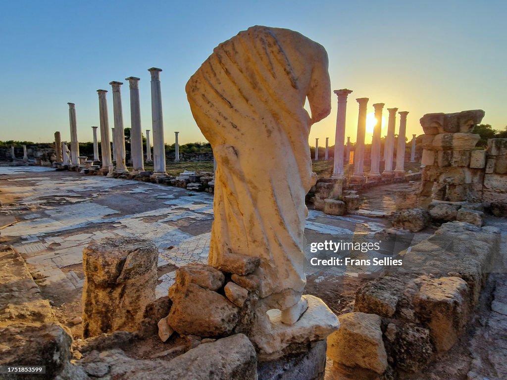 Colonnade of the Gymnasium and headless statue, Salamis, North Cyprus