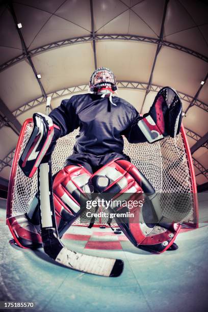 little league roller hockey goalkeeper in training - hockey goal stockfoto's en -beelden