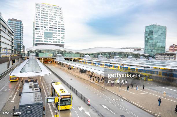 utrecht centraal railway station with trains arriving and departing - utrecht stock pictures, royalty-free photos & images