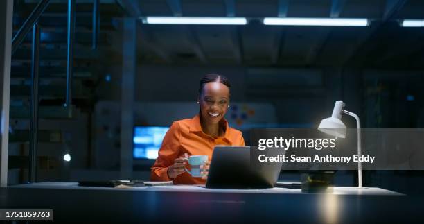 night, office and black woman with video call on laptop for networking communication, contact and online chat. dark, workplace and employee talking in virtual conference, webinar or b2b discussion - asking time stock pictures, royalty-free photos & images