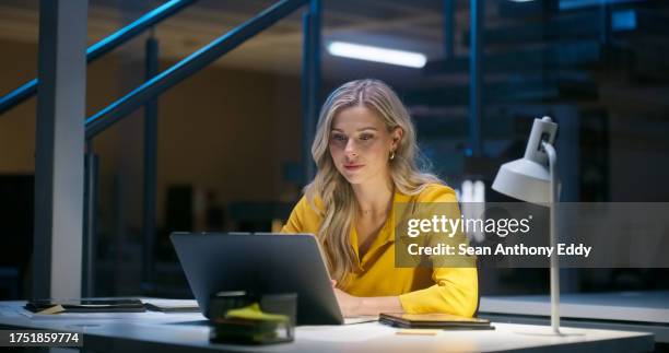 night, office and woman on laptop for research on breaking news, online information and writing an article. dark, workplace and employee with late review, report or writer with internet blog and post - artigo escrito imagens e fotografias de stock