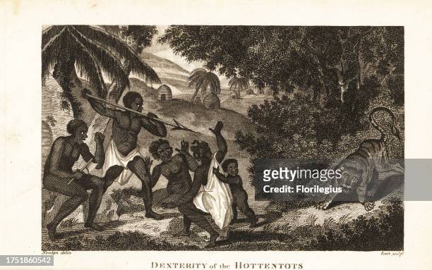 Khoisan men with assagai and ax protecting women and child from a tiger . Dexterity of the Hottentots. Copperplate engraving by J. Scott after an...