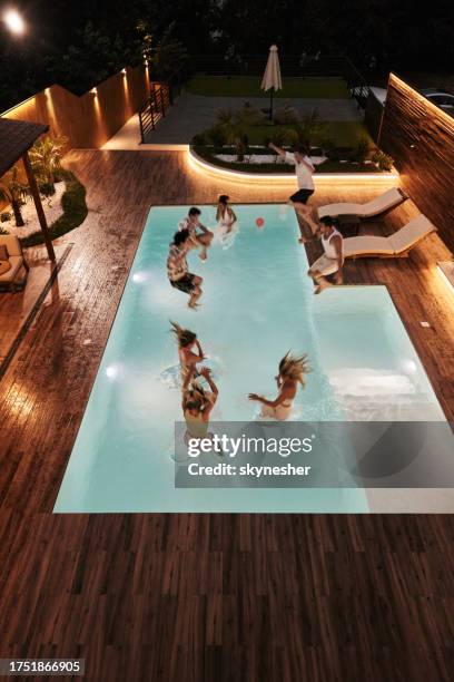 pool party at night! - pool party night stock pictures, royalty-free photos & images