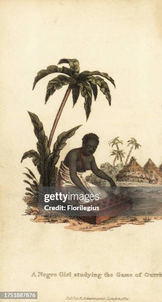 Woman playing the board game of Ouri, Senegambia. Also known as Wari, Oware and Ayoayo. A negro girl studying the game of Ourri. Negresse etudiant le...