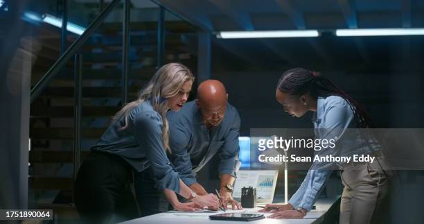 business people, night teamwork and documents for information technology, programming or cybersecurity planning. programmer, woman or manager writing ideas, digital research and strategy or solution - collaboration government stock pictures, royalty-free photos & images