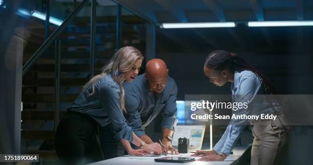 business people, night teamwork and documents for information technology, programming or cybersecurity planning. programmer, woman or manager writing ideas, digital research and strategy or solution - política imagens e fotografias de stock