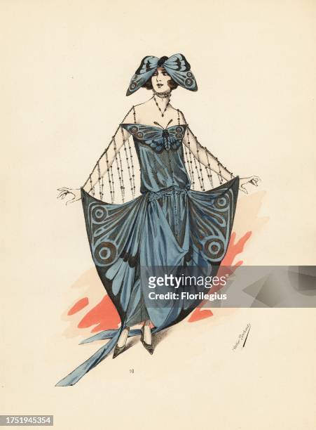 Woman in a fancy dress costume as a butterfly with painted crepe de Chine dress, winged hat, skirt wings tied to her hands by pearl ropes. Phalene en...