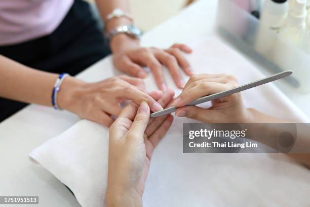 manicure - painting fingernails stock pictures, royalty-free photos & images