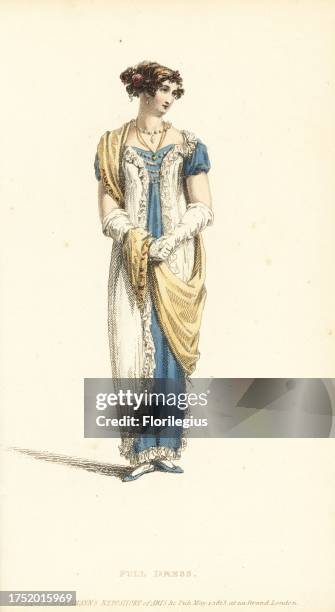 Regency woman in full dress. Evening dress of Polonese robe in white crepe over a celestial blue satin slip, hair in the Eastern style with flowers,...