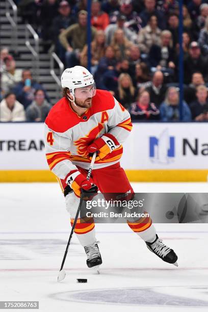 Rasmus Andersson of the Calgary Flames skates with the puck during the second period of a game against the Columbus Blue Jackets at Nationwide Arena...