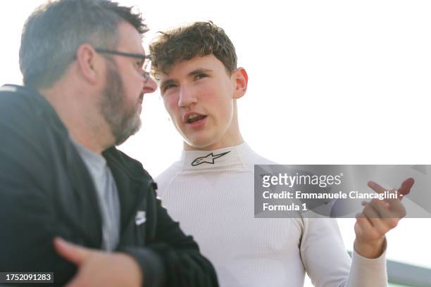 Alex Dunne of Ireland and Hitech Pulse-Eight talks in the Pitlane during day one of Formula 3 Testing at Autodromo Enzo e Dino Ferrari on October 23,...