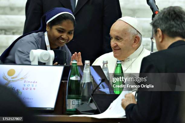 Pope Francis greets a delegate during the XVI Ordinary General Assembly of the Synod of Bishops at the Paul VI Hall on October 23, 2023 in Vatican...