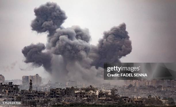 This image taken from the Israeli border with the Gaza Strip on October 29 shows black smoke ascending from the Gaza Strip amid the ongoing battles...