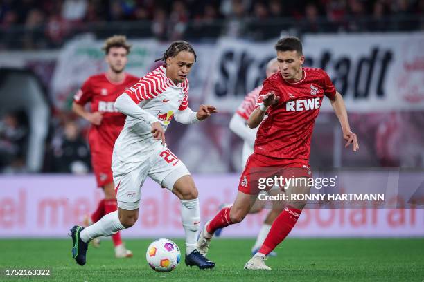 Leipzig's Dutch midfielder Xavi Simons and Cologne's Austrian midfielder Dejan Ljubicic vie for the ball during the German first division Bundesliga...